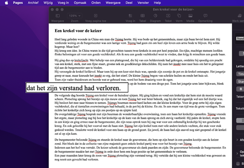 Tekst in Pages met daarbij de vergrote VoiceOver-cursor.